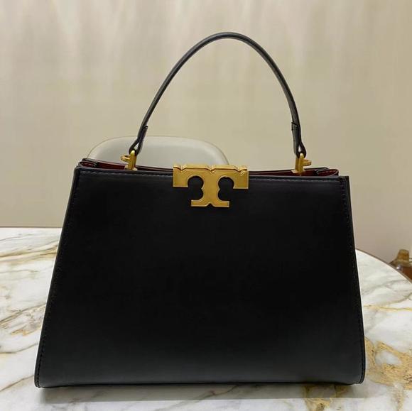Barely handled, in near-new condition. Tory Burch